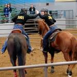 Kelsie Brock, left, and Hailey Robinett, right, celebrate after successfully sorting 10 calves during the cow sorting event at their first seasonal meet. Photo by Sierrabreeze Photography