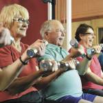 Lifting weights or using a resistance band for exercise is a great way for seniors to build strength. Image courtesy Metro Creative Connections