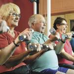 Lifting weights or using a resistance band for exercise is a great way for seniors to build strength. Image courtesy Metro Creative Connections