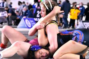 WRHS Hornet Shelby Moore, shown here wrapping up Graham-Kapowsin's Shelby-Rae Enos-Cressy, won a state title last weekend. Photo by Kevin Hanson