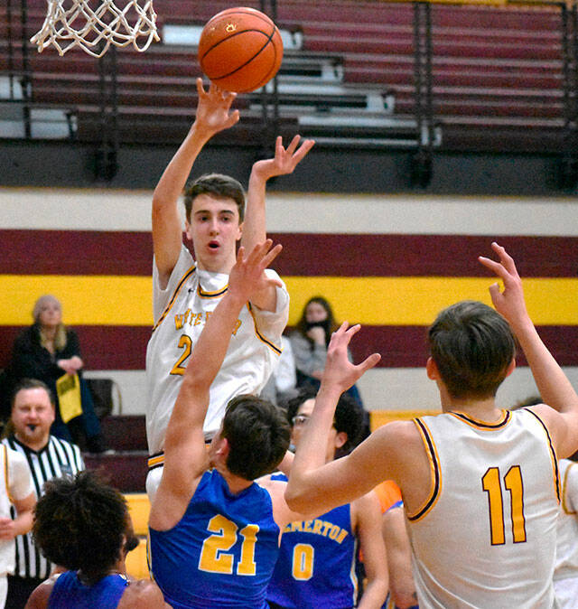 White Rivers boys opened district basketball action with a victory over Bremerton High on Feb. 16. Here, the Hornets Carson Voellger sends a pass to teammate Rylan Donovan (11) during the home-court, 74-62 win. The Hornets picked up another district victory on Feb. 18 before falling to North Kitsap in the tournament finale. The White River squad will play a regional game this weekend then head to the state Class 2A tournament in the Yakima Valley SunDome.