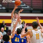 Pictured is Hornets Carson Voellger sending a pass to teammate Rylan Donovan (11) during the home-court, 74-62 win game against Bremerton on Feb. 16. File photo by Kevin Hanson