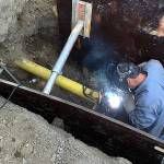 Enumclaw welder Nick Burden improving the gas line underneath Warner Avenue. Photo courtesy the city of Enumclaw