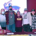 During a ceremony at White River High, a quartet of Hornet seniors signed letters sealing their agreement to play college ball before gathering for a photo with their coach, Kenny Pirone. From left are Cole Cashman, Wyatt Davis, Pirone, Ryan Stapleton and Payne Plaster. Photo by Kevin Hanson