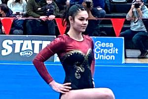 Enumclaw High's Julia Carter completes her routine in the floor exercise during Friday's state gymnastics championships. Photo by Kevin Hanson