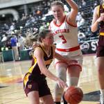 White Rivers Lexie Banks attempts a drive to the basket around a Washougal player. Photo courtesy Northwest Sports Photography