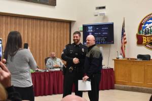 Photo by Alex Bruell
Buckley PD officer Arthur Fetter is promoted to sergeant during the city council meeting March 8. Standing next to him is mayor Beau Burkett.