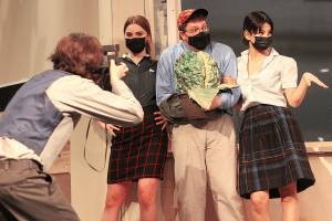 Starring in EHS' rendition of Little Shop of Horrors is Harry Gomes as Seymour, pictured holding a slightly-grown Audrey II, and Mercer Akeson as Audrey, who is singing a song early on in the musical number. Photos by Ray Miller-Still