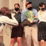 Starring in EHS rendition of Little Shop of Horrors is (above) Harry Gomes as Seymour, pictured holding a slightly-grown Audrey II, and (below) Mercer Akeson as Audrey, who is singing a song early on in the musical number. Photos by Ray Miller-Still