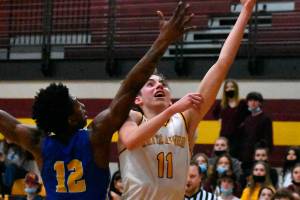Rylan Donovan, right, a senior member of the White River Boy's Basketball team, is the team's Most Valuable Player this year. (File photo)