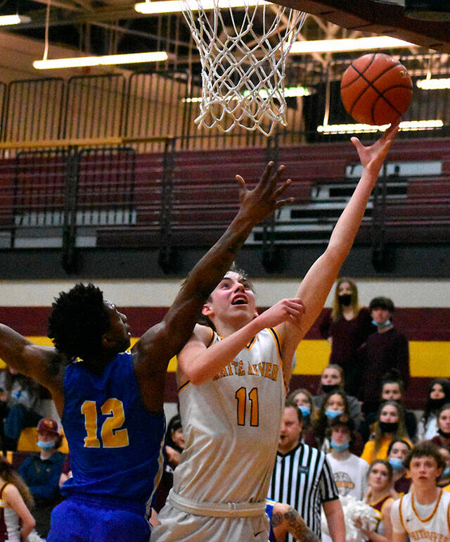 Rylan Donovan, right, a senior member of the White River Boys Basketball team, is the teams Most Valuable Player this year. (File photo)