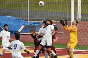 White River's Nick Panin returns this year as a senior goalkeeper. Pictured is a 2021 game against the Trojans. Photo by Kevin Hanson