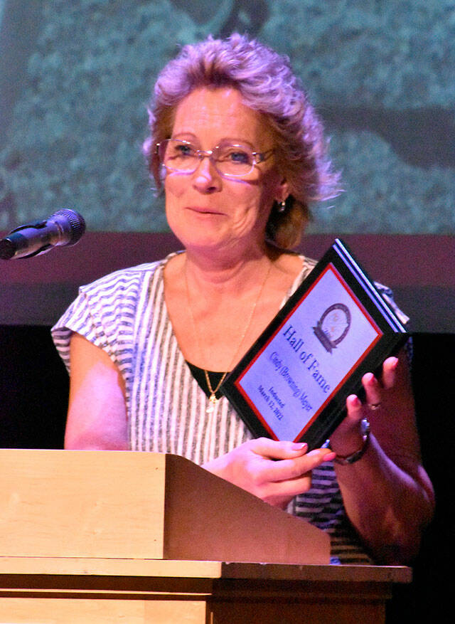 Cindy (Browning) Meyer, a two-time state champion at WRHS, accepts her award at the induction ceremony. Photo by Kevin Hanson