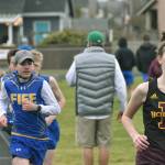 Ava Sawyer, right, and Lindsay Essex, far left, posted first and second place showings, respectively, in the girls 1600 meter run during Enumclaws March 17, 2022 bout against Fife. File photo by Alex Bruell