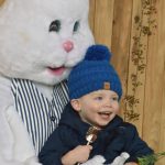 Ross Larson, 2, gets his picture taken with the Easter Bunny on Friday at Thomasson Family Farm in Enumclaw during a visit with his parents Kate and Neil. Photo by Alex Bruell