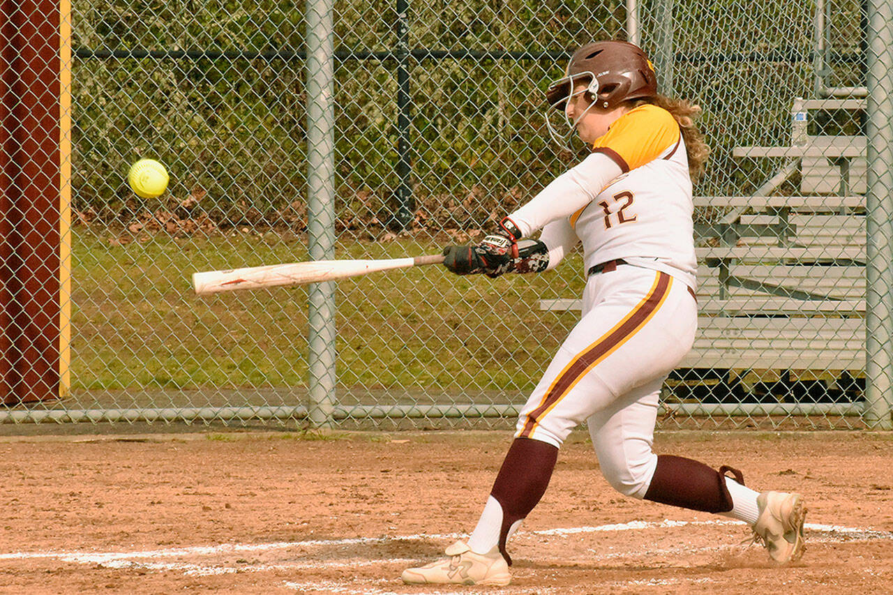 Megan Klapperich puts a ball into play during the Hornets lopsided fastpitch victory over the Washington Patriots. Photo by Kevin Hanson