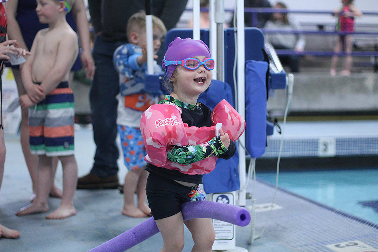 Whether youre at the pool or the beach, water safety is paramount  which is why the Enumclaw Aquatic Center hosted April Pools Day on April 16, teaching kids of all ages the importance of a properly-fitted life jacket, how to rescue someone with a life preserver, and how to get in and out of a boat safely. Pictured is Eve Funk, rocking her her pool fit. Photo by Ray Miller-Still