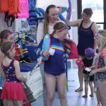 Brooklyn Funk getting fitted with a life jacket. Photo by Ray Miller-Still