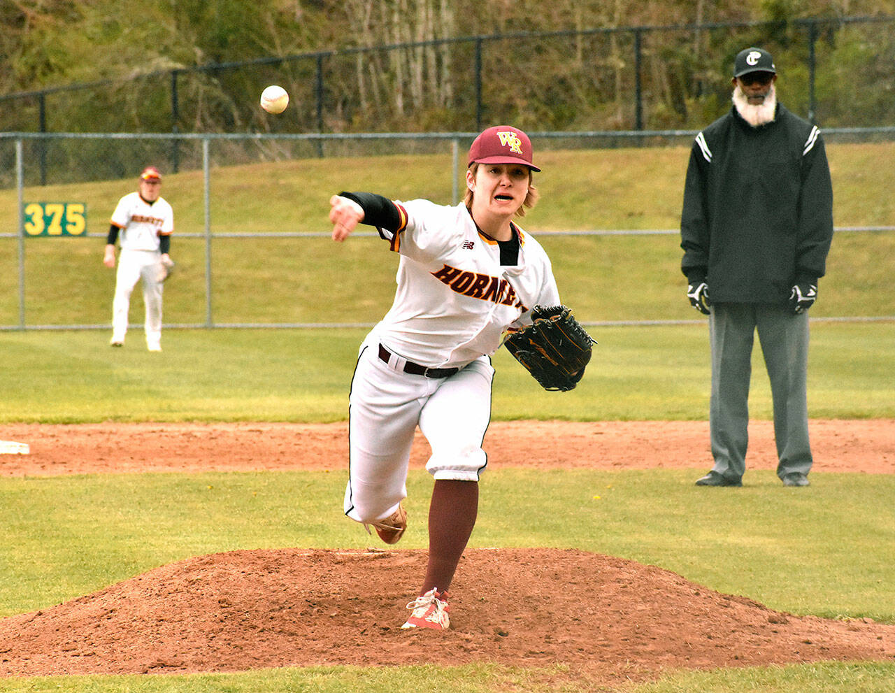 White River sophomore Finn Still delivers during the early stages of a recent Hornet game on the Buckley campus. The squad has a busy week if the weather allows, hosting the Franklin Pierce Cardinals today (Wednesday) and traveling to Fife for a Thursday game against the Trojans before Fridays Battle of the Bridge showdown against Enumclaw. Fridays contest for Plateau bragging rights will be played at White River beginning at 4 p.m. Photo by Kevin Hanson