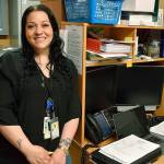 Samantha Burrow stands in her no-frills office at the Enumclaw Jail, from where she helps inmates talk through their troubles and plan for their release. Photo by Alex Bruell