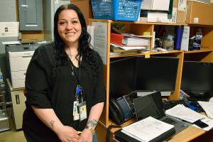 Samantha Burrow stands in her no-frills office at the Enumclaw Jail, from where she helps inmates talk through their troubles and plan for their release. Photo by Alex Bruell