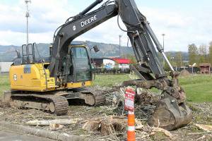 In conjunction with city improvement to streets and parking lots, the Thunder Dome Car Museum, seen in the background, is preparing to pave over the field behind the Enumclaw library to turn it into a parking lot. It will mostly be public use, though the museum can close it for private functions up to 48 hours at a time (up to 12 times a year, and never no more than twice during a single month), and for a full seven consecutive days once per year. A timeline on this project is not yet set, but ground should be broken "soon" with a goal to complete by summer's end, a representative of the museum said. Photo by Ray Miller-Still