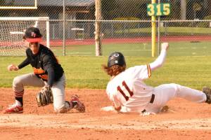 The White River High defeated visiting Franklin Pierce 16-8 last week. Above, Hornet first baseman Tyson Campbell handles an infielder's throw to record an easy out. The regular season wraps up this week for South Puget Sound League 2A baseball teams. Photo by Kevin Hanson