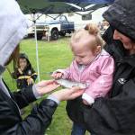 Young kids and their families had a reel good time at Uncle John's pond last weekend for the RV park's annual fishing derby, and several children managed to catch some two-plus pound whoppers. Pictured above is Jaelyn Anderson showing off her first catch of the morning to Stevie Frick. Photos by Ray Miller-Still
