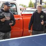 Michael Johnson flashes a smile and a thumbs up as he explains the work he's put into his '69 Chevy Stepside.