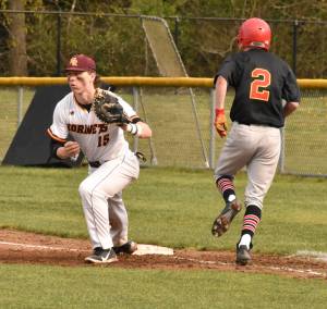 PHOTO BY KEVIN HANSON 
The regular season concluded in rainy fashion last week for South Puget Sound League 2A baseball players, but the campaign was a successful one for both local Hornet squads. Enumclaw High captured the league championship and White River finished in a second-place tie. Both teams were scheduled to open District 2/3 play Tuesday afternoon, EHS as the No. 2 seed into districts (vs. No. 7 Olympic) and White River as No. 4 (vs. No. 5 Steilacoom). Opening-round victories would bring semifinal games on Saturday; a Tuesday loss would mean playing again today (Wednesday) in a loser-out round. Above, White Rivers Tyson Campbell completes an easy out during a recent home game on the Buckley campus.