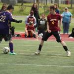 White River put up a strong fight but ultimately took second place against the first-place Puyallup Vikings at the Special Olympics Unified Soccer League district tournament in Enumclaw on Saturday, May 14. The Enumclaw Hornets, meanwhile, took third. The Unified Sports program pairs a roughly equal number of athletes with intellectual disabilities with partners who dont have intellectual disabilities for training and competition. Pictured is Makenzie Baker (No. 1) and Sebastien Cox (No. 6). Photo by Alex Bruell.