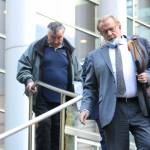 Photo by Ray Miller-Still 
Allan Thomas and his attorney John Henry Browne exit the U.S. District Court building in Seattle following his conviction on several of the counts he was charged with in the drainage district trial.