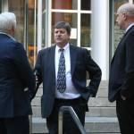 Photo by Ray Miller-Still 
Attorneys for the United States debrief outside the U.S. District Court building in Seattle following the end of the Joann and Allan Thomas trial.