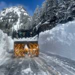 WSDOT shared this image of a snow blower fighting huge walls of snow on SR 410 Chinook Pass, which crews estimated on May 19 would remain closed for a few more weeks.