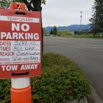Trees separating the Enumclaw library parking lot from the nearby field have already been cut down, and grinding will soon begin in preparation of that field turning into a parking lot. Photo by Ray Miller-Still