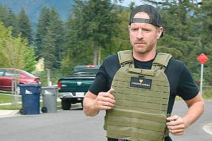 Butch Holman, an Enumclaw resident with cystic fibrosis, is performing a grueling workout in honor of a Navy SEAL this Memorial Day weekend. Photo by Alex Bruell