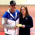 PHOTO BY ED HAWTHORNE
Justin Newby, president of the Washington State Wrestling Association, presented Shelby Moore with a $1,000 check during a ceremony in Buckley.