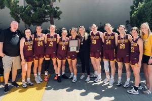 The White River varsity squad won five straight games in San Diego to take the tournament championship. Making up the squad were (from left) coach Chris Gibson, Dakota Sprouse, Josie Jacobs, Ava Bright, Lexie Banks, Morgan Greene, Mackenzie Hinson, Ella Klemkow, Vivian Kingston, Ally Green, Jadyn Olson, and assistant coach Rani Wiegand. Submitted photo