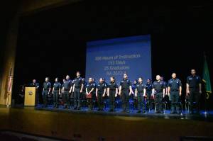 The 25 graduates stand during their graduation ceremony at White River High School.