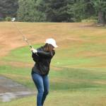 PHOTO BY KEVIN HANSON The greens and fairways were turned crimson and gray on a Saturday morning in 2021 when the Enumclaw Golf Course played host to a tournament that raised money for the WSU wrestling program. In this photo, Heather McCann begins with a drive down the first fairway. She was one of 37 participants who helped generate $13,500 for the Cougar program that year. Aside from players, money came from 20 businesses and individual sponsors, an auction of 28 donated items and the sale of WSU wrestling T-shirts. Phil Burnett, who coaches the WSU team, is an Enumclaw resident.