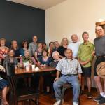 Photo by Alex Bruell 
Carl Lee sits for a photo with the friends hes made over the years at the Buckley Food Bank and Buckley Kiwanis Club.