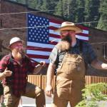A pair representing the Buckley Foothills Historical Museum pass through downtown Wilkeson. Photo by Alex Bruell