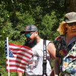 A pair of racers celebrate and catch their breath after making a run on the handcars. Photo by Alex Bruell