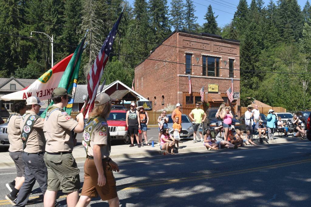The local boy scouts troop makes their way down Wilkeson during the parade. Photo by Alex Bruell
