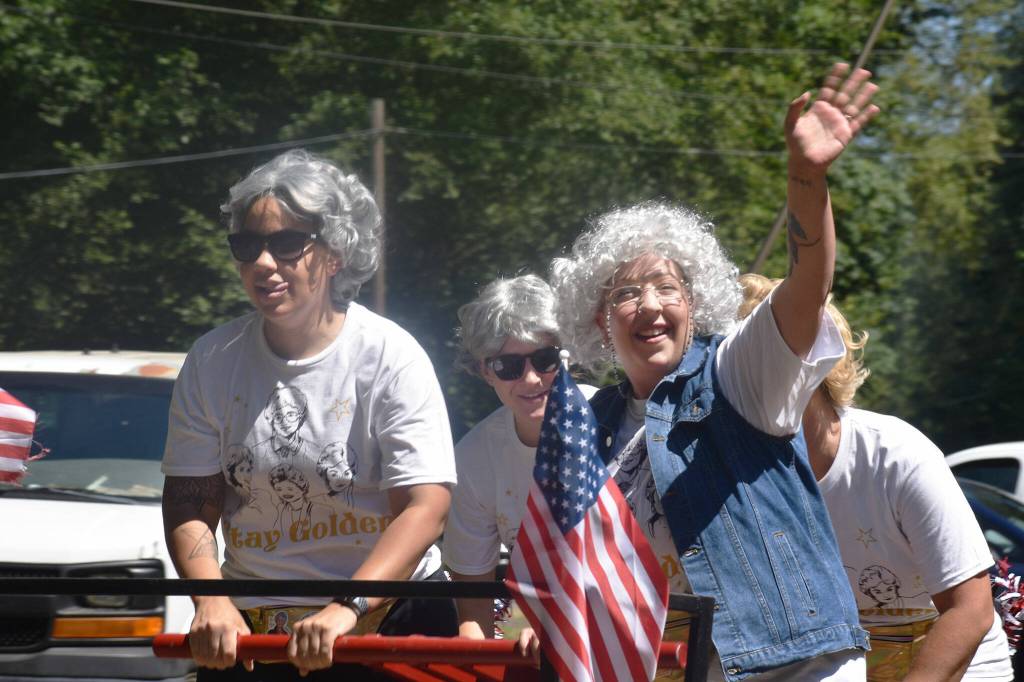 A team of Golden Girls-inspired racers celebrates on the way back from their trek down the tracks. Photo by Alex Bruell