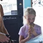 The first bite is always the best: Reese Olsen enjoys a cone of ice cream at The Scoop in Buckley. Photo by Alex Bruell.