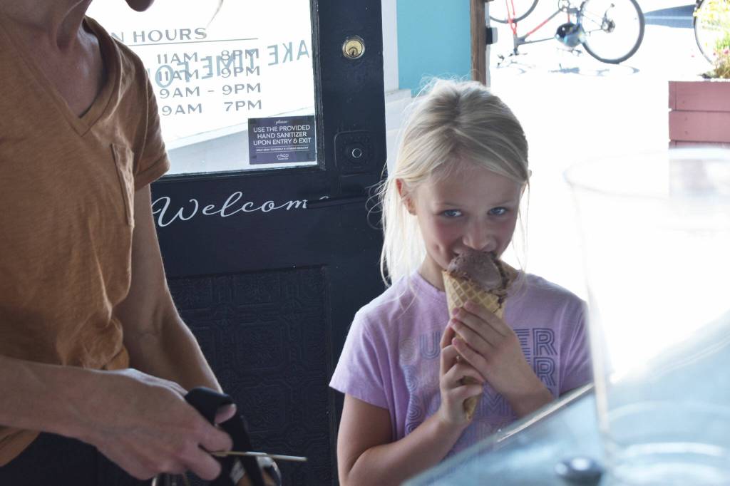 The first bite is always the best: Reese Olsen enjoys a cone of ice cream at The Scoop in Buckley. Photo by Alex Bruell.