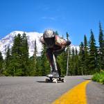 Local skateboarders like Marcie Morgan sometimes train in the Mount Rainier National Park area. When skaters like Morgan go out to practice, they start by scoping out the road – learning how it twists and turns, clearing obstacles like gravel or branches. Low-traffic, one-way roads are ideal and worth taking long drives, she said. Despite your best efforts, you will fall, like Morgan did at a recent qualifier race in Vermont. Im fine, she said: I banged up my knee a little, but as we say in this sport, if youre not falling, youre not learning. Photo by Alex Bruell.