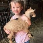 Deyton Cunningham holds Elsa the goat. Photo courtesy Venise Cunningham