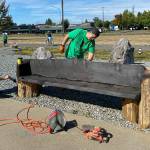 Volunteers in Buckley touched up a Foothills Trail bench during its 2020 event. Photo courtesy Amy Molen